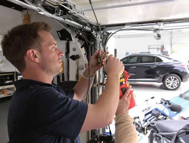 Buckeye Garage Door Repair safety certified technician performing cable replacement in Buckeye