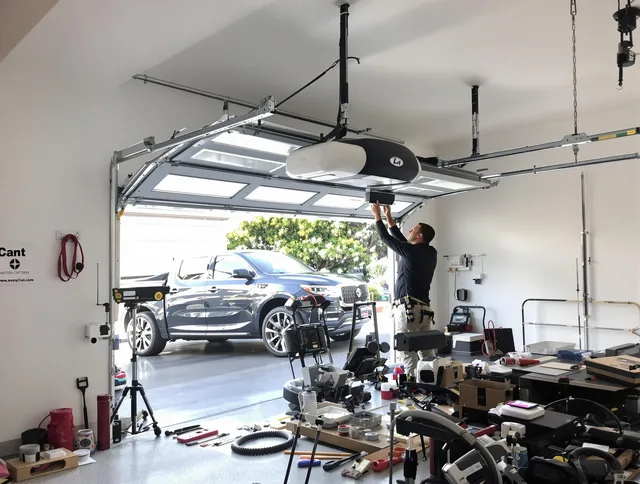 Buckeye Garage Door Repair specialist installing smart garage door opener system in Buckeye home