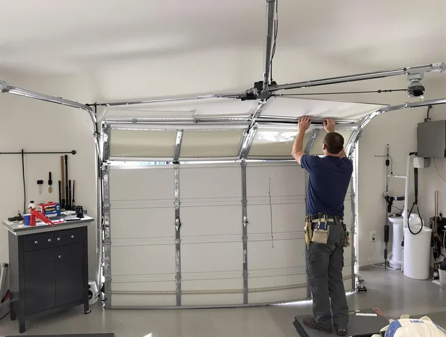 Buckeye Garage Door Repair specialist performing precise section replacement on Buckeye garage door